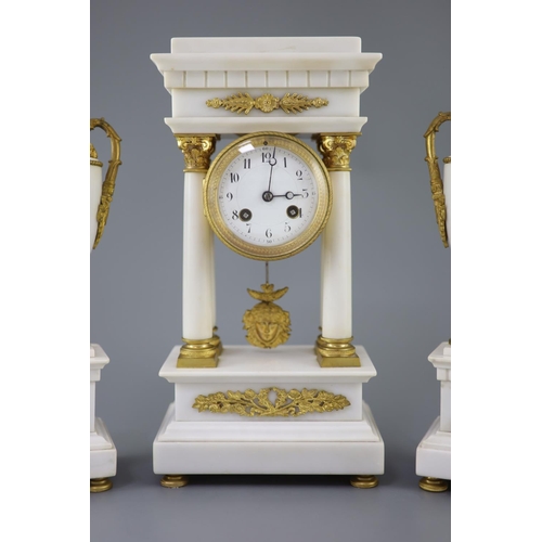 297 - A Louis XVI style ormolu mounted white marble clock garniture, with Portico clock flanked by a pair ... 