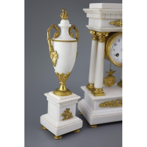 297 - A Louis XVI style ormolu mounted white marble clock garniture, with Portico clock flanked by a pair ... 