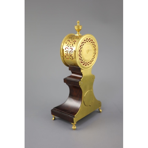 298 - Week's Museum. A Regency gilt brass and mahogany drum case mantel timepiece, with urn final, enamel ... 