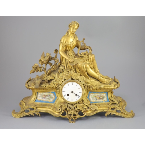 299 - A 19th century French ormolu mantel clock, retailed by J & W Marshall, Paris, surmounted with a figu... 