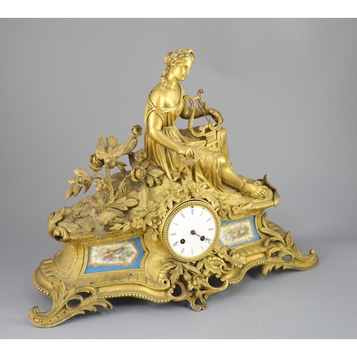 299 - A 19th century French ormolu mantel clock, retailed by J & W Marshall, Paris, surmounted with a figu... 