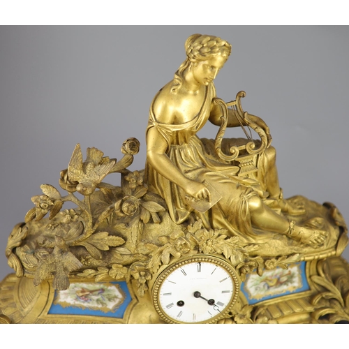 299 - A 19th century French ormolu mantel clock, retailed by J & W Marshall, Paris, surmounted with a figu... 