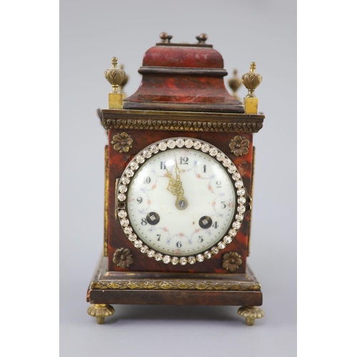 300 - An early 20th century red tortoiseshell veneered mantel timepiece, with paste set bezel and ormolu m... 