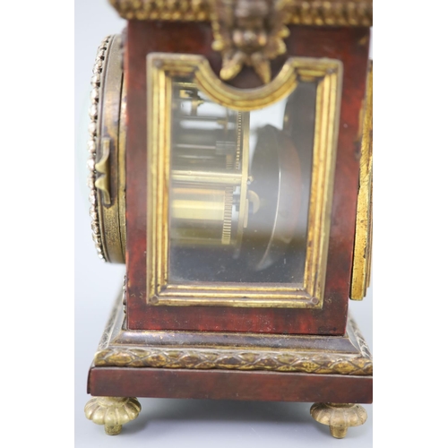 300 - An early 20th century red tortoiseshell veneered mantel timepiece, with paste set bezel and ormolu m... 