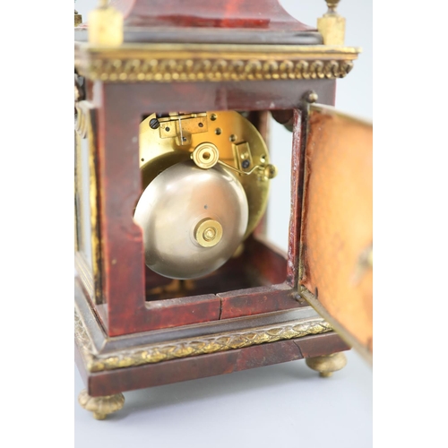 300 - An early 20th century red tortoiseshell veneered mantel timepiece, with paste set bezel and ormolu m... 