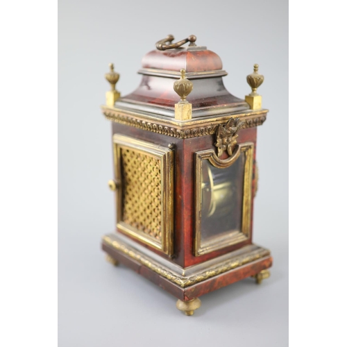 300 - An early 20th century red tortoiseshell veneered mantel timepiece, with paste set bezel and ormolu m... 