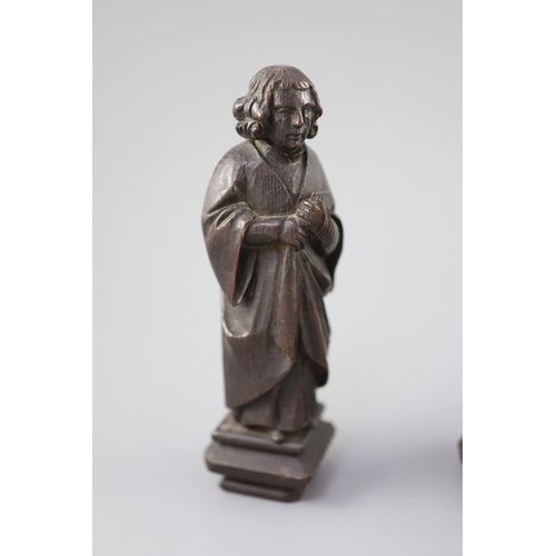 31 - Four English oak figures of Evangelists, three possibly c.1425-50, one a 19th century copy, from Rom... 