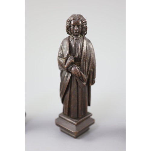 31 - Four English oak figures of Evangelists, three possibly c.1425-50, one a 19th century copy, from Rom... 