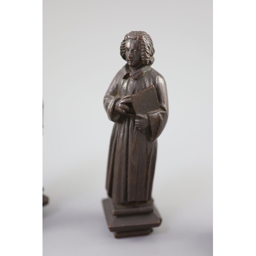 31 - Four English oak figures of Evangelists, three possibly c.1425-50, one a 19th century copy, from Rom... 