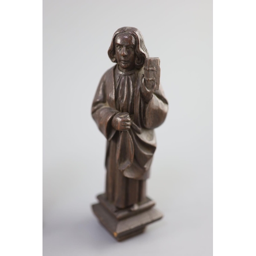 31 - Four English oak figures of Evangelists, three possibly c.1425-50, one a 19th century copy, from Rom... 