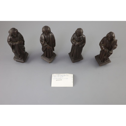 31 - Four English oak figures of Evangelists, three possibly c.1425-50, one a 19th century copy, from Rom... 