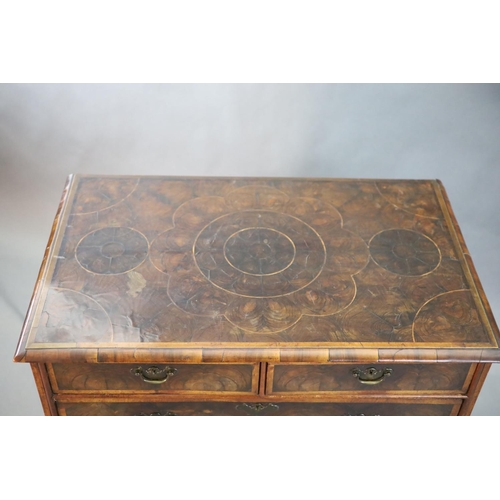 315 - An early 18th century oyster veneered chest, of two short and three graduated long drawers, on later... 