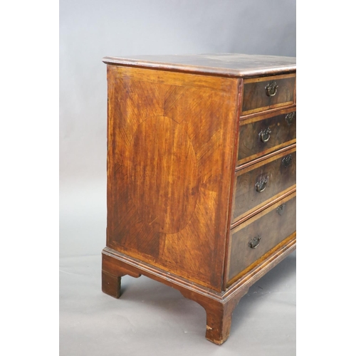 315 - An early 18th century oyster veneered chest, of two short and three graduated long drawers, on later... 