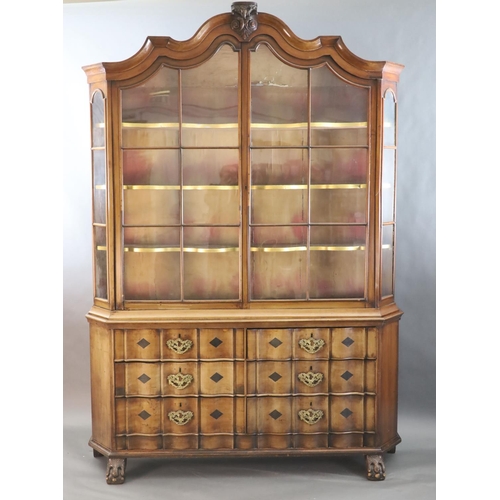 316 - A late 18th century Dutch walnut serpentine vitrine, with moulded serpentine top, two barred glazed ... 