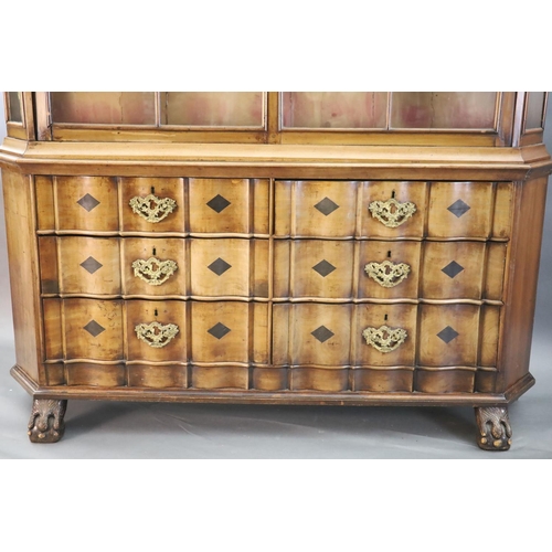 316 - A late 18th century Dutch walnut serpentine vitrine, with moulded serpentine top, two barred glazed ... 