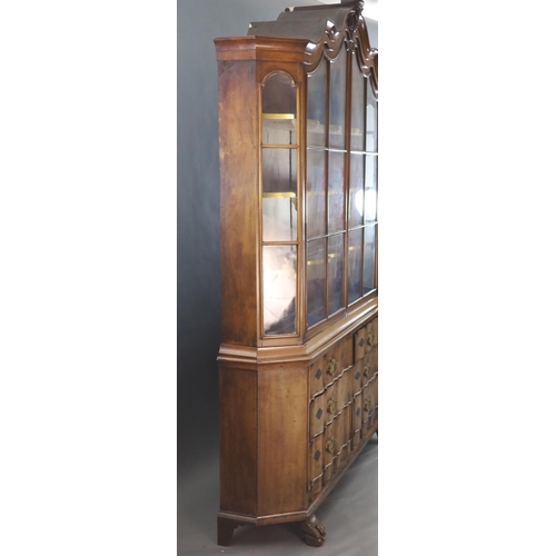 316 - A late 18th century Dutch walnut serpentine vitrine, with moulded serpentine top, two barred glazed ... 