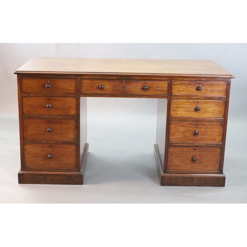 318 - A George III mahogany kneehole desk, with plain rectangular top and nine drawers, fitted knob handle... 