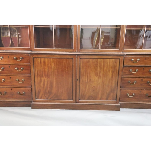 324 - A George III mahogany breakfront library bookcase, with moulded cornice and four astragal glazed doo... 