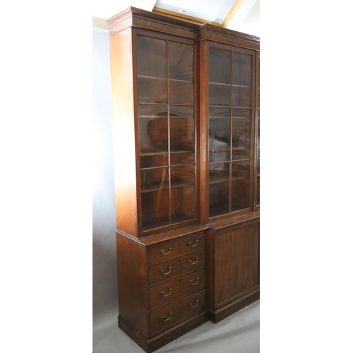 324 - A George III mahogany breakfront library bookcase, with moulded cornice and four astragal glazed doo... 