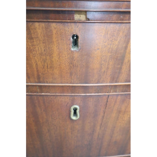 326 - A George III mahogany and rosewood banded serpentine fronted chest, fitted brushing slide and four g... 