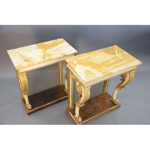 328 - A pair of William IV parcel gilt cream painted and rosewood console tables, with later marble tops a... 