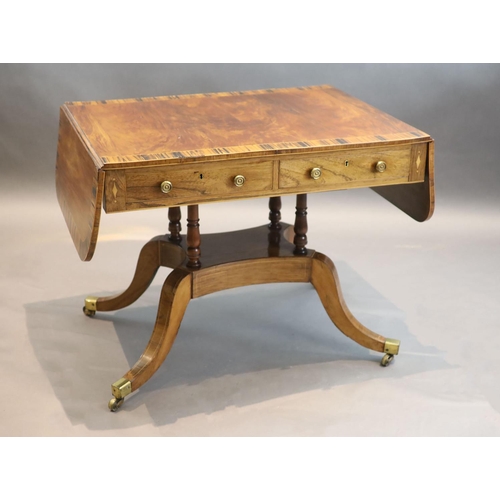 329 - A Regency mahogany sofa table banded in coromandel, with d shaped flaps and two frieze drawers, on f... 