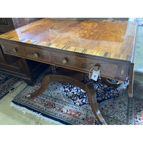 329 - A Regency mahogany sofa table banded in coromandel, with d shaped flaps and two frieze drawers, on f... 