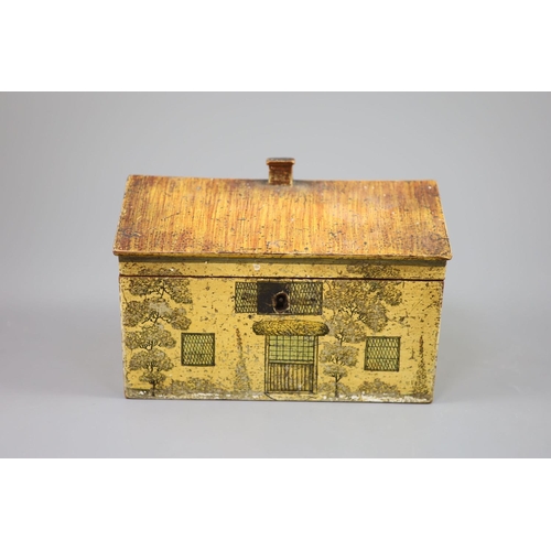 33 - A Regency painted and penwork work box, modelled as a cottage, with leaded windows, plants around th... 