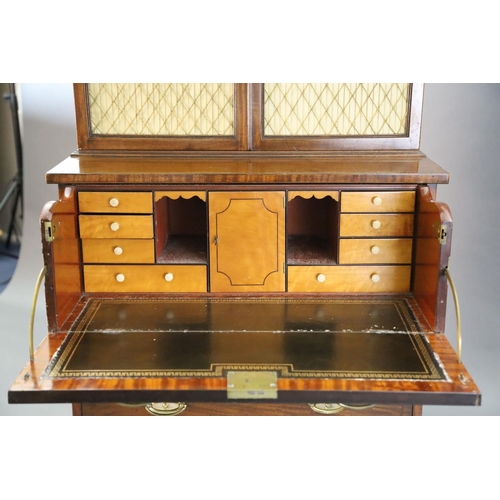 332 - A Regency mahogany secretaire bookcase, with initialled dentil cornice and two brass grilled doors e... 