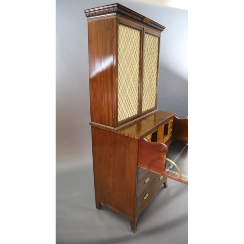 332 - A Regency mahogany secretaire bookcase, with initialled dentil cornice and two brass grilled doors e... 