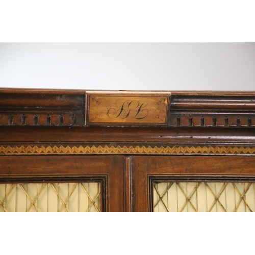 332 - A Regency mahogany secretaire bookcase, with initialled dentil cornice and two brass grilled doors e... 