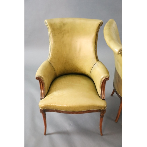 333 - A pair of Regency style leather and mahogany library chairs, with brass studded olive green leather ... 