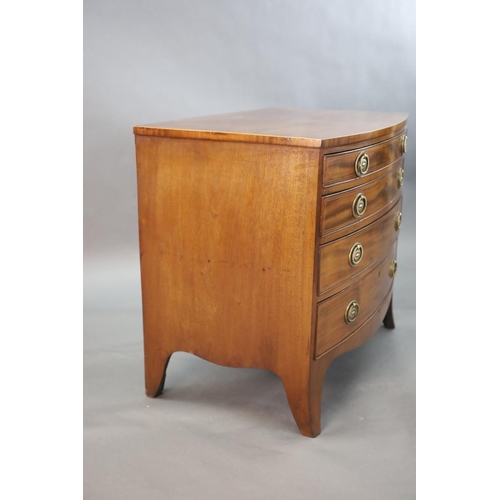 336 - A Regency crossbanded mahogany bowfront chest, of four graduated long drawers, on swept bracket feet... 