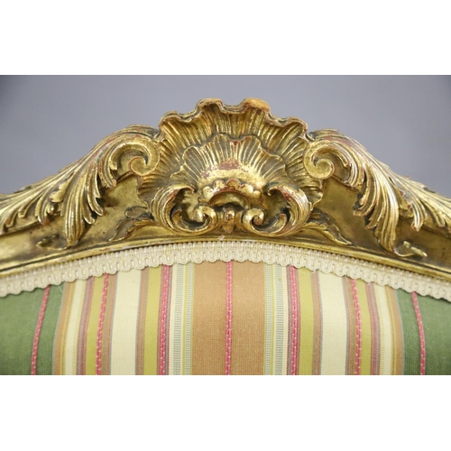 341 - A pair of French gilt beech fauteuils, with moulded foliate scroll carved frames and cabriole legs, ... 