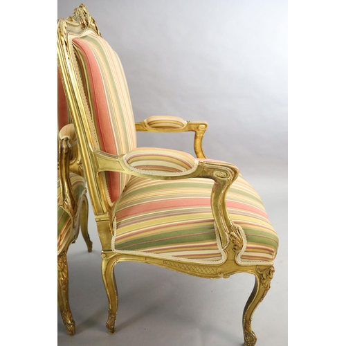 341 - A pair of French gilt beech fauteuils, with moulded foliate scroll carved frames and cabriole legs, ... 