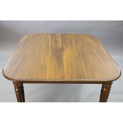 342 - A Victorian mahogany extending dining table, with rounded rectangular top and three spare leaves, on... 