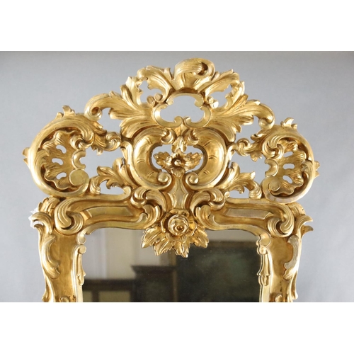 344 - A late 19th century French carved giltwood wall mirror, of generous proportions, decorated with pier... 