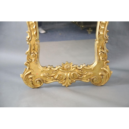 344 - A late 19th century French carved giltwood wall mirror, of generous proportions, decorated with pier... 