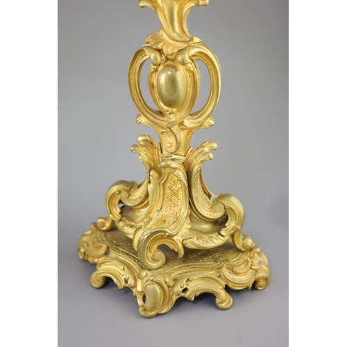 35 - A pair of late 19th century French Louis XV style ormolu seven light candelabra, with foliate scroll... 