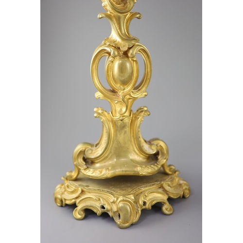 35 - A pair of late 19th century French Louis XV style ormolu seven light candelabra, with foliate scroll... 