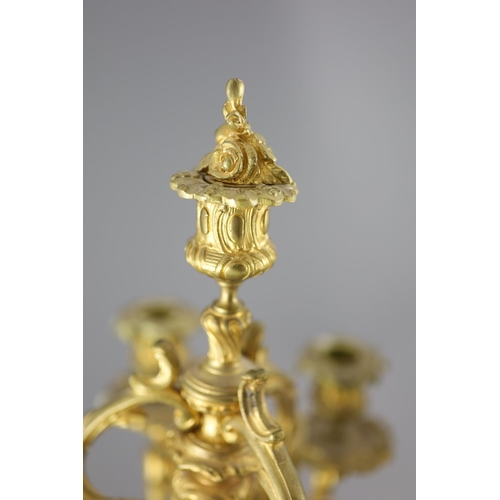 35 - A pair of late 19th century French Louis XV style ormolu seven light candelabra, with foliate scroll... 