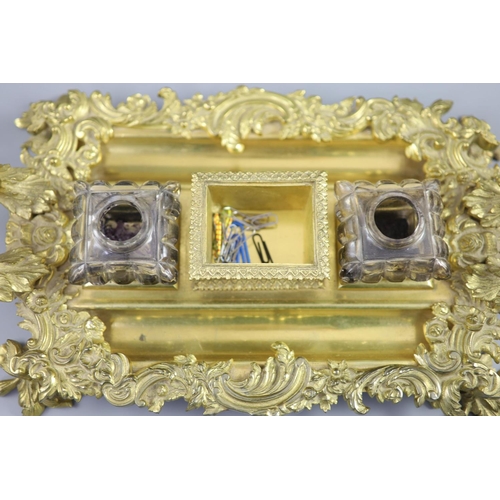 36 - A Victorian ormolu ink stand, the central wafer box applied with a bust of a Shakespeare and flanked... 