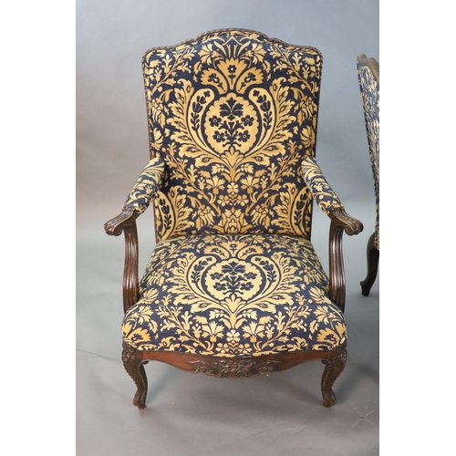 360 - A pair of Louis XVI style mahogany fauteuils, with gadroon and floral scroll carved frames, later up... 