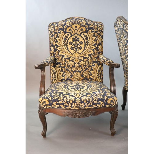 360 - A pair of Louis XVI style mahogany fauteuils, with gadroon and floral scroll carved frames, later up... 