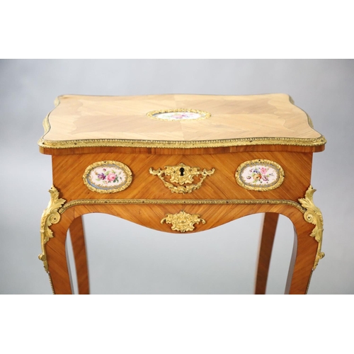 362 - A late 19th century French Louis XV style ormolu kingwood work table, inset with Sevres style porcel... 