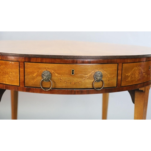 369 - An Edwardian marquetry inlaid satinwood drum top library table, with starburst top inlaid with styli... 