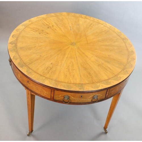 369 - An Edwardian marquetry inlaid satinwood drum top library table, with starburst top inlaid with styli... 