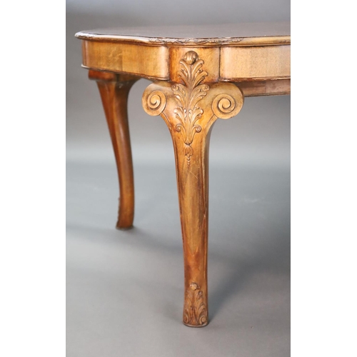 371 - A Queen Anne style burr walnut extending dining table, the shaped top with moulded leaf carved borde... 