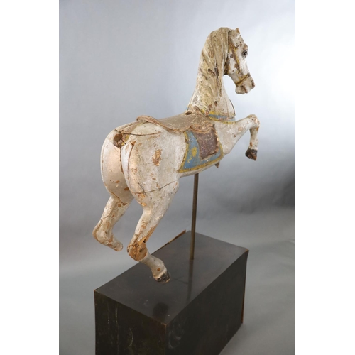 375 - A 19th century, probably American, painted wood carousel horse, upon display stand, the horse with r... 