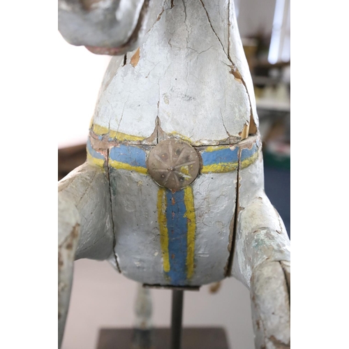 375 - A 19th century, probably American, painted wood carousel horse, upon display stand, the horse with r... 